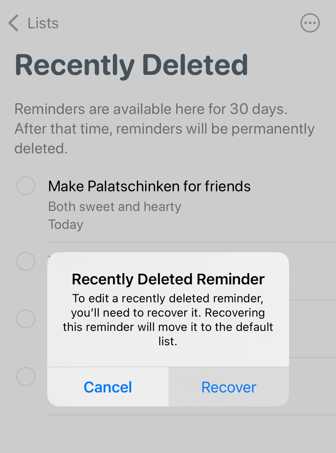 Tap “Recover” to restore a deleted task to the default list in Apple Reminders for iPhone
